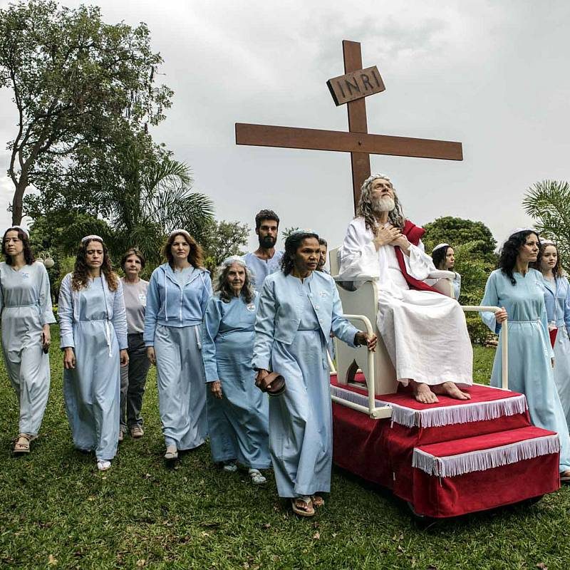 Brazil. 2014. Brasilia.
INRI Cristo’s disciples rolling him around on the compound grounds on his rolling pedestal.
INRI (born Alvaro Theiss) takes his rst name from the initials of the inscription the Romans placed on the cross to spite him 2,000 years ago: Iesus Nazarenus Rex Iudaeorum, or Jesus of Nazareth, King of the Jews. The first awaking as the Christ came already in 1979 during a fast in Santiago of Chile, and INRI subsequently spent many years as a wandering preacher before settling in New Jerusalem, which is located outside of Brasilia.
Most of the dozen or so disciples who live inside INRI’s compound are women. While the 69-year old Saviour and his followers live a private and secluded life, they are also busy disseminating his teachings to the world via the Internet, using YouTube, music videos and live broadcasts of sermons. From the book “The Last Testament”.